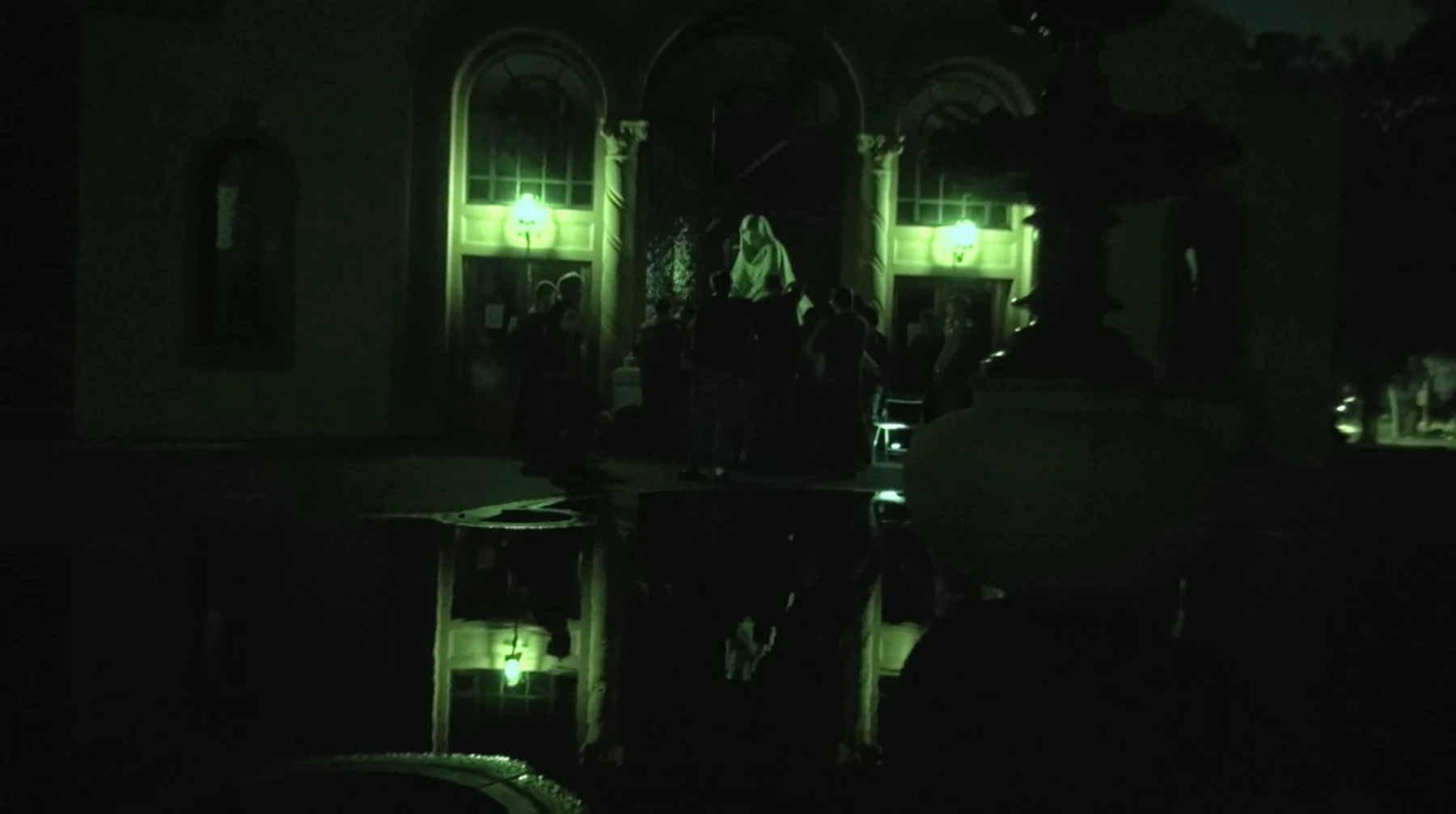 The dark, green-lit environment of The Whistler.