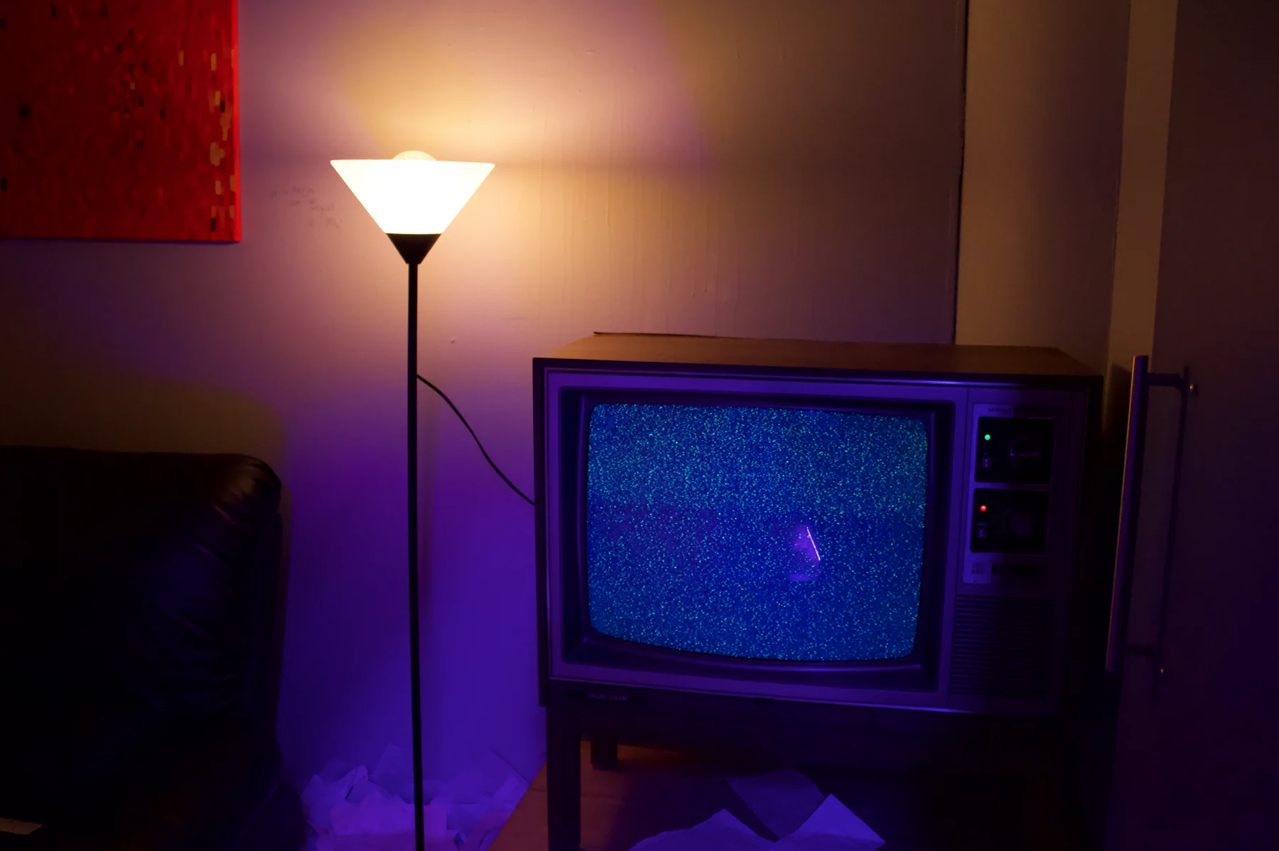 An old television and lamp in Choir of the Impossible.