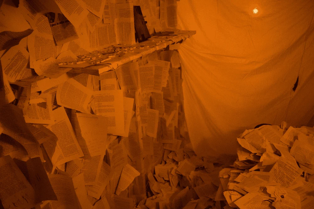 A room filled with paper in Choir of the Impossible.