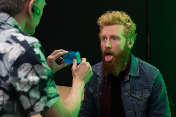 A performer reacts during a uCare examination.