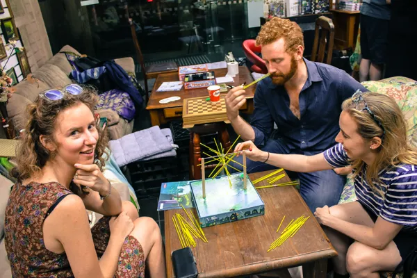 Players lean towards a tabletop game.