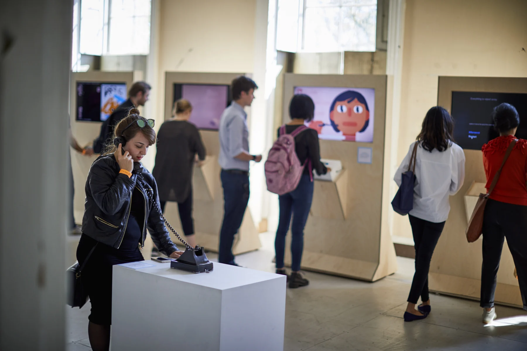 Visitors sharing the Telephone installation.