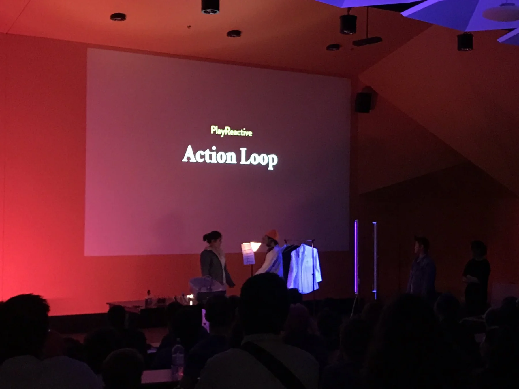 The Action Loop title projected above the stage at Freeplay Parallels.